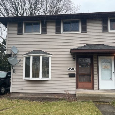 front of a two storey house